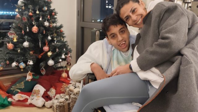 Mother hugging her son dearly