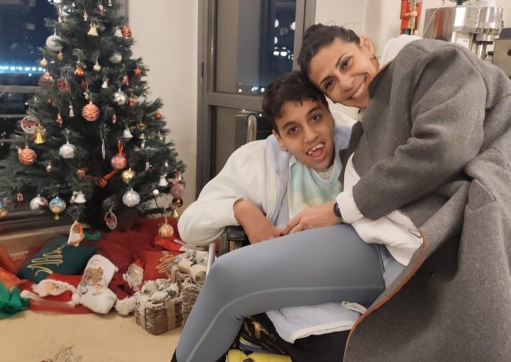 Mother hugging her son dearly